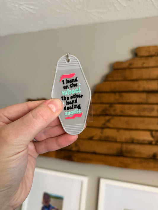 Dealin’ Snacks Motel Keychain